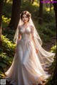 A woman in a wedding dress standing in the woods.